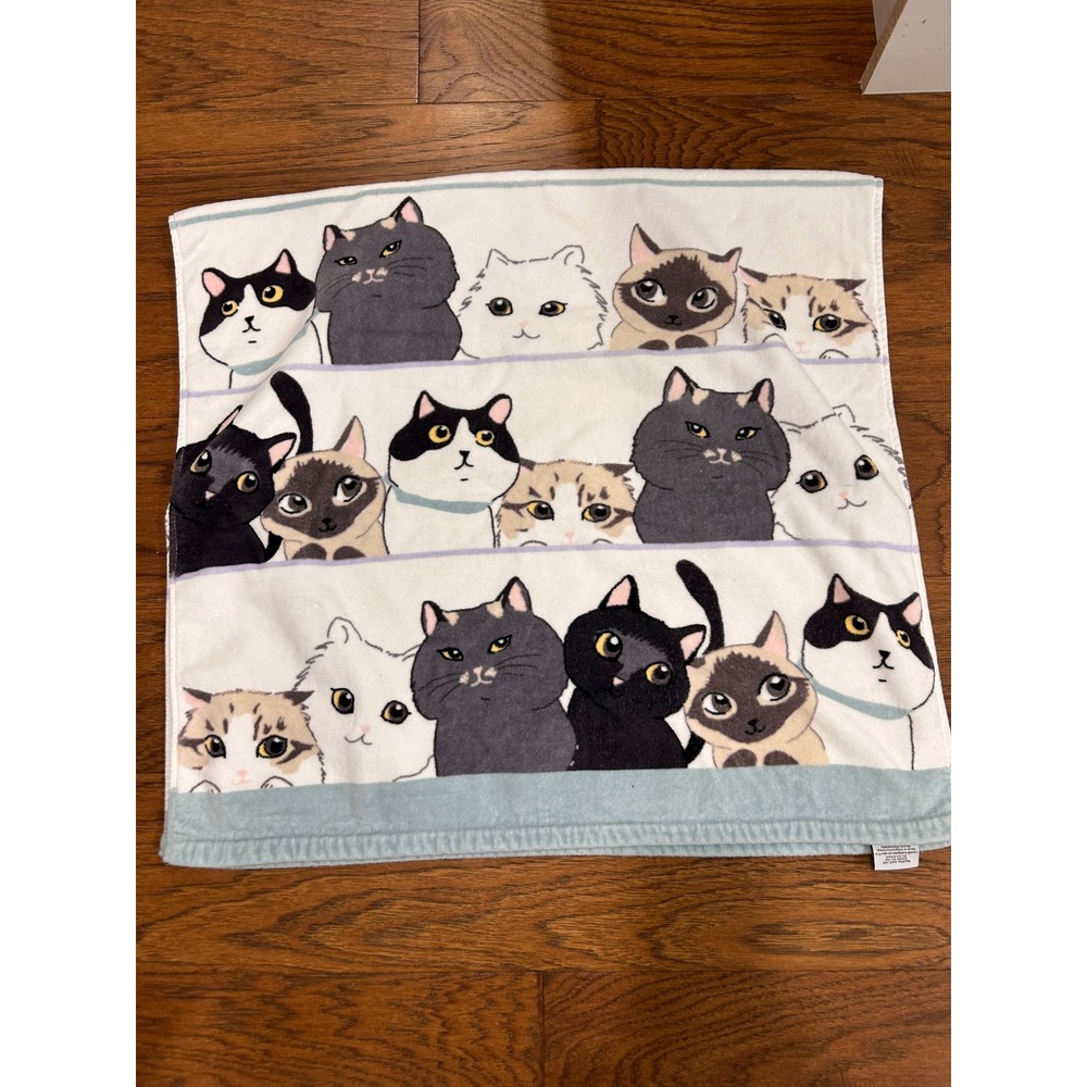 Kassafina  towel featuring a kitty cat faces pattern